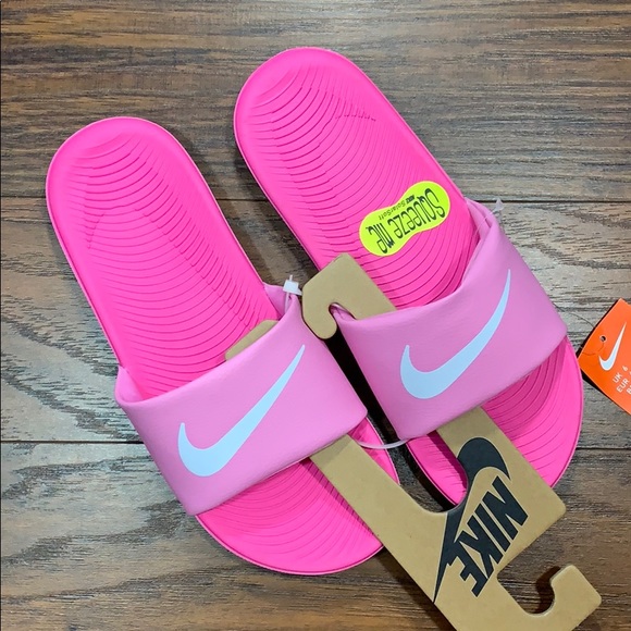 pink and white nike slides